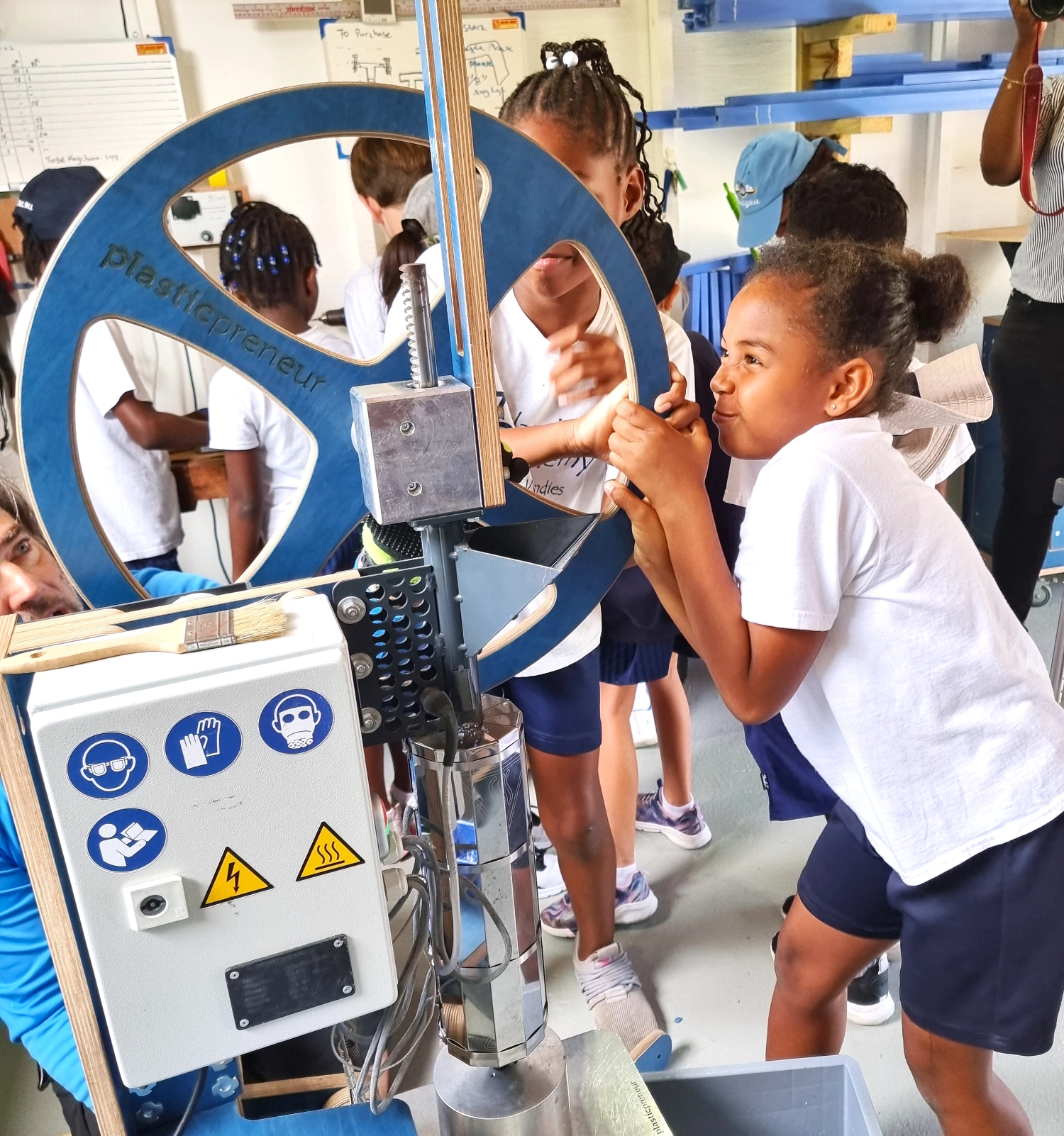 Island Academy Students turning the wheel at the WISH Workshop