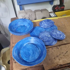 Plastic bowls and coasters made from bottle caps