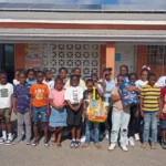 Students from the Newfield Primary Showcase show off all the bottlecaps they collected!