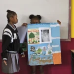 Students of the Sea View Farm Primary School present their poster for session 2