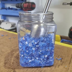 Shredded bottle caps in a jar