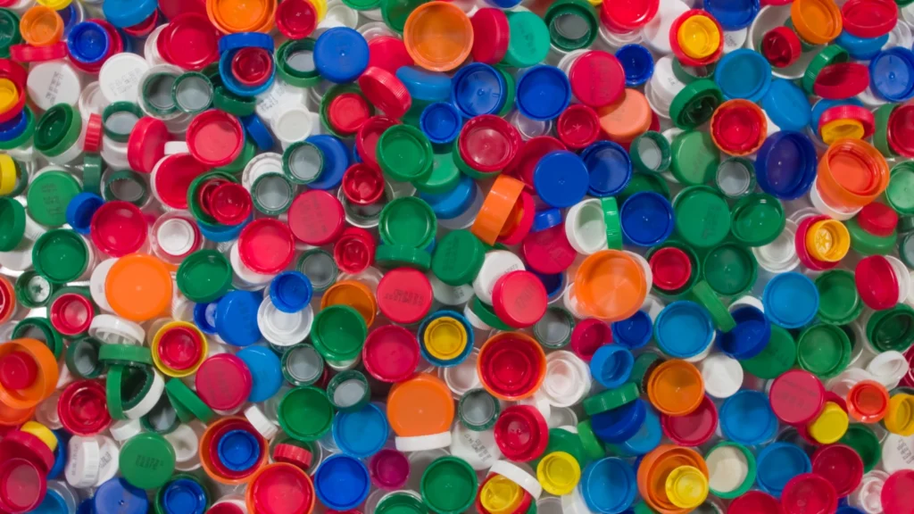 An assortment of bottle caps in different sizes and colors