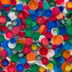 An assortment of bottle caps in different sizes and colors