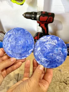 Coasters made from bottlecaps imprinted with the islands Antigua and Barbuda